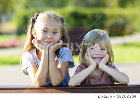 Portrait of a sister and brother of preschool age. Portrait of a sister and brother of preschool age. 59203504