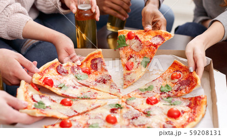 Lunch delivery. Friends taking slices of hot pizza Lunch delivery. Friends taking slices of hot pizza 59208131