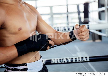 Boxer is swapping hands before punching. 59209461