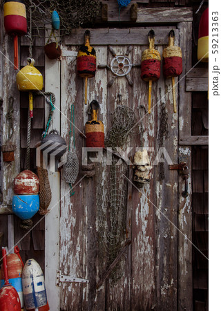 Door with fishnets and lobster buoys 59213363