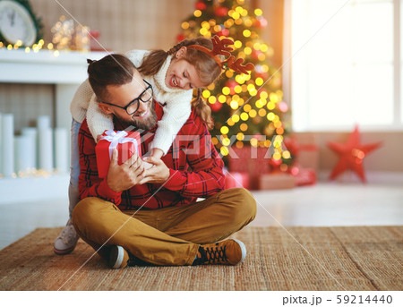 happy family father and child daughter giving 59214440