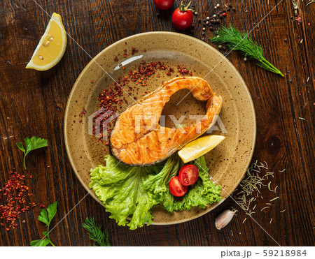grilled salmon steak on the wooden background 59218984