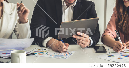 Businessman and businesswomen working in office. 59220998