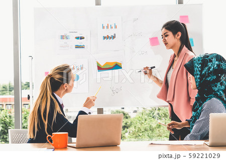 Multicultural working group in teamwork meeting. Multicultural working group in teamwork meeting. 59221029