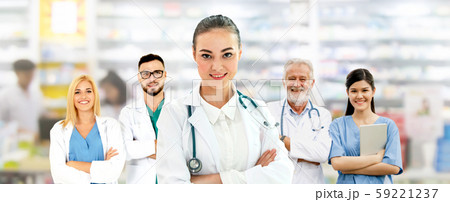 Doctor working in hospital with other doctors. 59221237