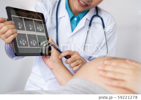 Pregnant Woman and Gynecologist Doctor at Hospital Pregnant Woman and Gynecologist Doctor at Hospital 59221278