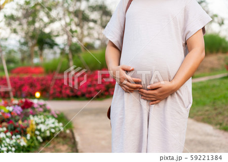 Happy pregnant woman and expecting baby at home. Happy pregnant woman and expecting baby at home. 59221384