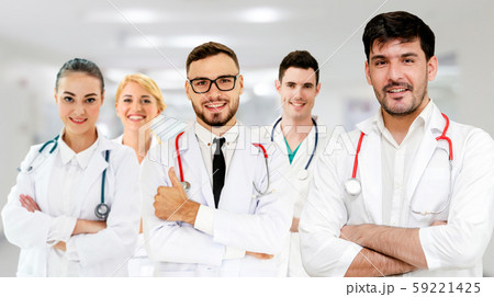 Doctor working in hospital with other doctors. 59221425