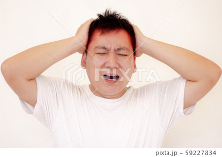 Young man is suffering from a headache,Concept healthcare and medical. 59227834
