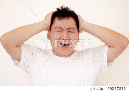Young man is suffering from a headache,Concept healthcare and medical. 59227836