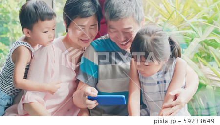 grandparents use phone with family grandparents use phone with family 59233649