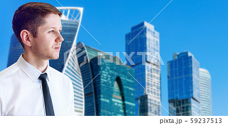 Portrait of businessman over cityscape background. 59237513