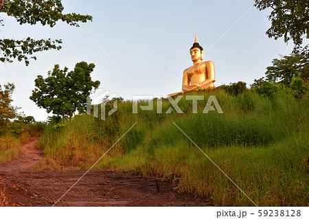 The big golden Buddha statue of Phu Salao temple The big golden Buddha statue of Phu Salao temple 59238128