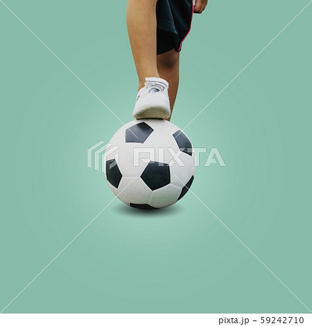 Closeup feet of a boy wearing white sneakers Closeup feet of a boy wearing white sneakers 59242710