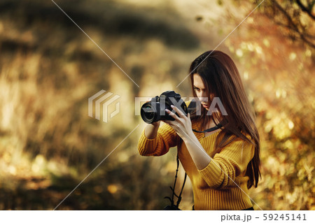 women photographer hold camera 59245141