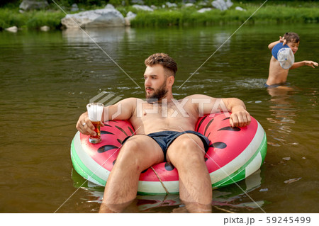 man with beard is drifting along the river on man with beard is drifting along the river on 59245499
