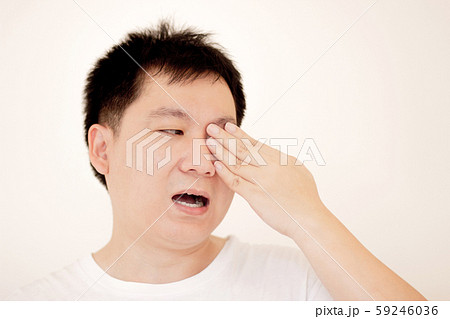 Man suffering from strong eye pain. portrait of young male feeling sick. 59246036