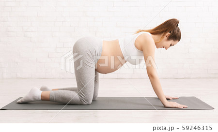 Prenatal exercises. Pregnant woman learning right breathing 59246315