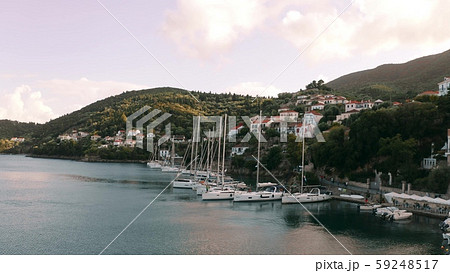 Aerial view of docked sailing boats. Kioni, Ithaca island, Greece Aerial view of docked sailing boats. Kioni, Ithaca island, Greece 59248517