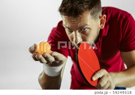 Young man playing table tennis on white studio background Young man playing table tennis on white studio background 59249318