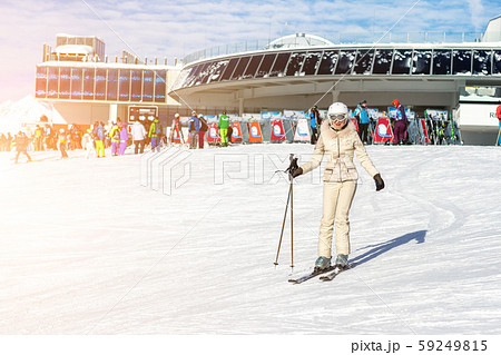 Portrait of young adult beautiful happy caucasian woman smiling near lift station at alpine winter 59249815