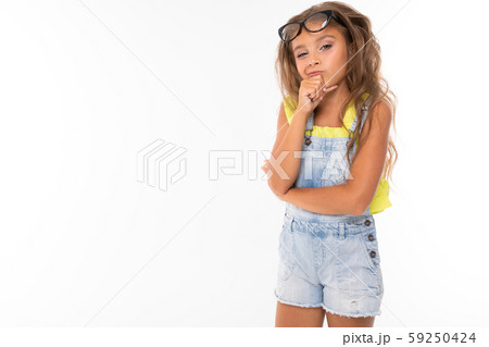 Teenager caucasian girl stands and thinking about something Teenager caucasian girl stands and thinking about something 59250424