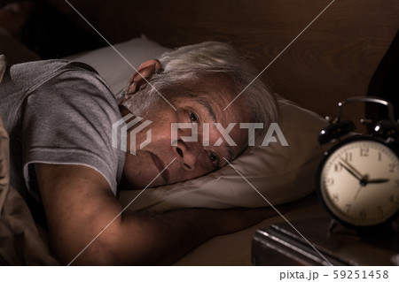 Depressed senior man lying in bed cannot sleep from insomnia Depressed senior man lying in bed cannot sleep from insomnia 59251458