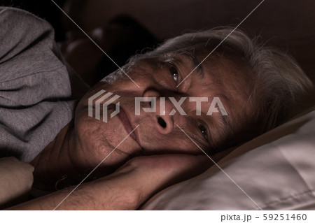 Depressed senior man lying in bed cannot sleep from insomnia Depressed senior man lying in bed cannot sleep from insomnia 59251460