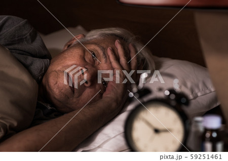 Depressed senior man lying in bed cannot sleep from insomnia Depressed senior man lying in bed cannot sleep from insomnia 59251461