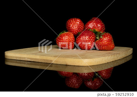 Fresh red strawberry isolated on black glass Fresh red strawberry isolated on black glass 59252910