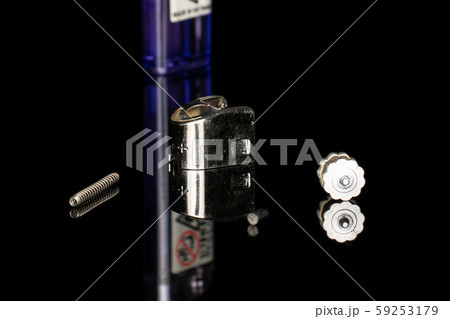 Plastic lighter isolated on black glass Plastic lighter isolated on black glass 59253179