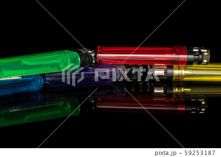 Plastic lighter isolated on black glass Plastic lighter isolated on black glass 59253187