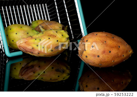 Green prickly pear isolated on black glass 59253222