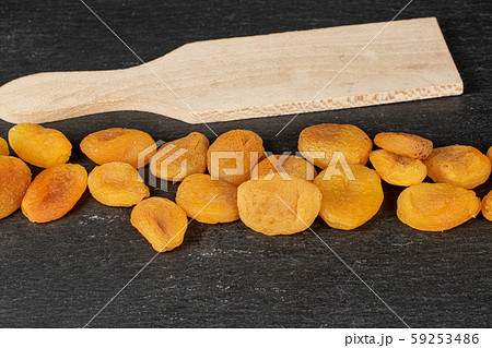 Dried orange apricot on grey stone 59253486