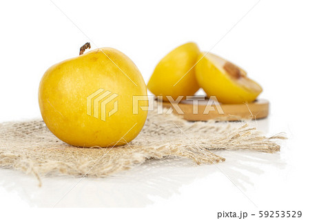 Fresh yellow plum isolated on white 59253529