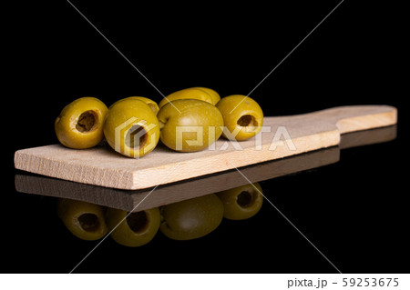Green pitted olive fruit isolated on black glass 59253675