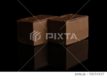 Sweet viennese nougat isolated on black glass Sweet viennese nougat isolated on black glass 59254337