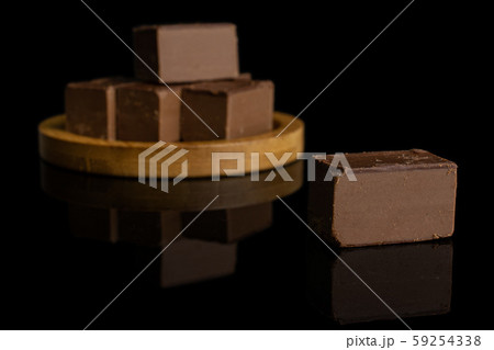 Sweet viennese nougat isolated on black glass Sweet viennese nougat isolated on black glass 59254338