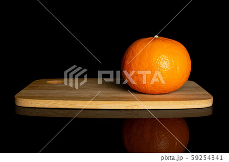 Fresh orange mandarine isolated on black glass 59254341