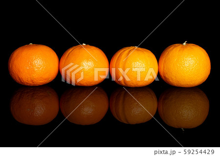 Fresh orange mandarine isolated on black glass Fresh orange mandarine isolated on black glass 59254429