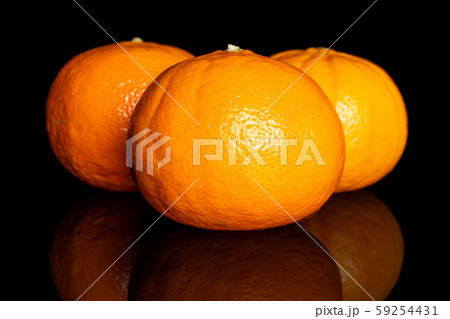 Fresh orange mandarine isolated on black glass 59254431