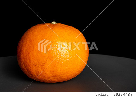 Fresh orange mandarine isolated on black glass Fresh orange mandarine isolated on black glass 59254435