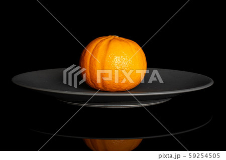 Fresh orange mandarine isolated on black glass Fresh orange mandarine isolated on black glass 59254505