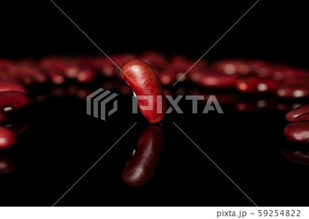 Fresh red kidney bean isolated on black glass Fresh red kidney bean isolated on black glass 59254822