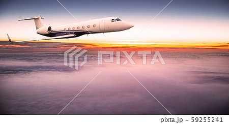 Private jet plane flying above dramatic clouds. 59255241