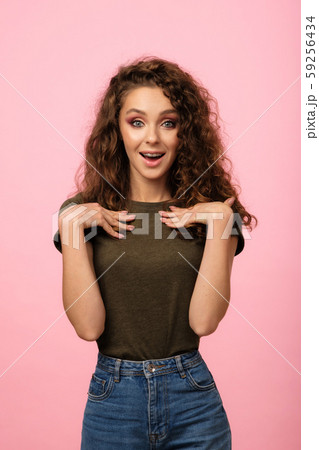 Pretty girl isolated on pink background Pretty girl isolated on pink background 59256434