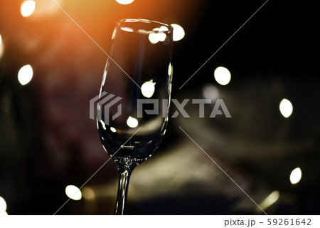 Champagne glass on table against blurred lights 59261642