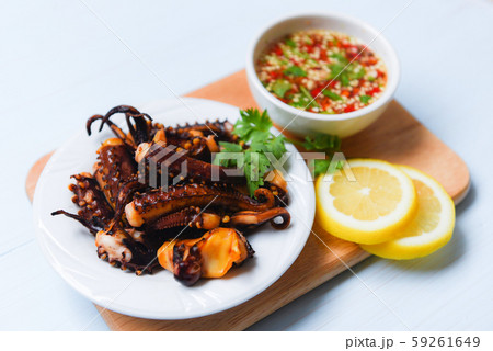 octopus salad with lemon herbs and spices on white octopus salad with lemon herbs and spices on white 59261649