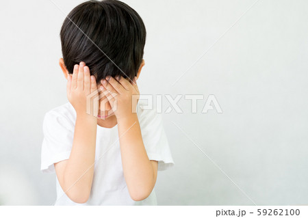 Child's problem concept: A little boy standing alone hands cover his face crying with sad. Bullying, Child loneliness, Autism awareness, Traumatic event,The Problem of Child Development. Child's problem concept: A little boy standing alone hands cover his face crying with sad. Bullying, Child loneliness, Autism awareness, Traumatic event,The Problem of Child Development. 59262100