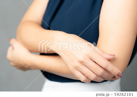 Closeup of a beautiful stylish 40+ woman's skin - hands and arms. Dryness, Itch, Aging skin problem, Elderly, Elastin decrease, Sign of age, Derma care, Water loss, Dehydrated skin, Moisturizer. 59262101